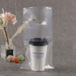 Une tasse de thé au lait dans un sac à main, une tasse de boissons à emporter, quatre tasses de sacs en plastique logo personnalisé Une tasse de thé au lait dans un sac à main, une tasse de boissons à emporter, quatre tasses de sacs en plastique logo personnalisé